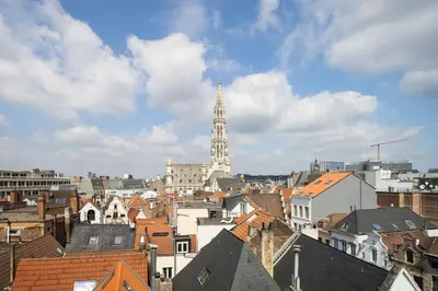 a view of a city with a clock tower at ALMA Grand Place Hotel in Brussels