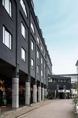 a large black building with a lot of windows at pentahotel Leuven in Leuven