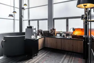 an office with a counter and windows at pentahotel Leuven in Leuven