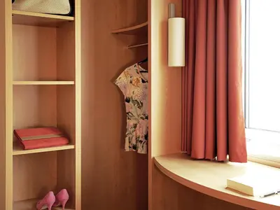 a room with a book shelf and a window at ibis Aalst in Aalst