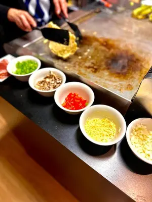 a counter top with bowls of ingrediating ingrediantspectspectssenalsenalsenalsenal at Hotel Vé in Mechelen