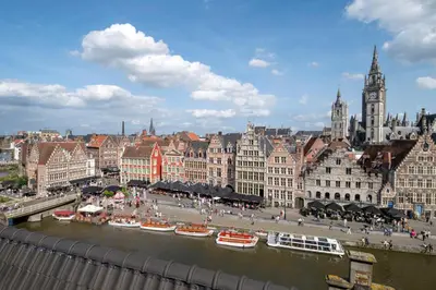 a view of a city with a river and buildings at Ghent Marriott Hotel in Ghent