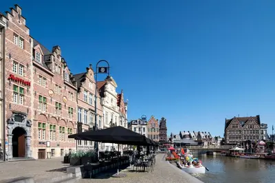 a group of people sitting in a boat on a river at Ghent Marriott Hotel in Ghent