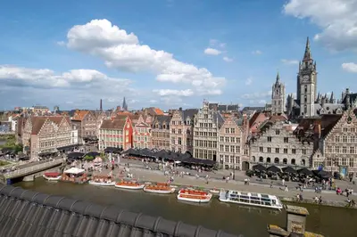 a view of a city with a river and buildings at Ghent Marriott Hotel in Ghent