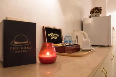 a counter top with a box and a candle on it at Hotel The Lord in Ghent