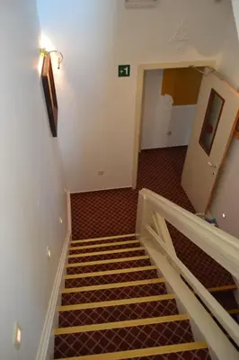a staircase in a room with a stair case at Hotel The Lord in Ghent