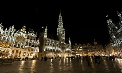 a group of buildings in a city at night at Hotel City Center in Brussels