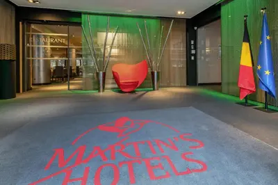 a lobby with a marlins logo on the floor of a building at Martin's Brussels EU in Brussels