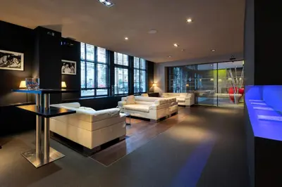 a living room with two couches and a table at Martin's Brussels EU in Brussels