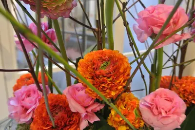 a bunch of flowers in a glass vase at Hotel La Legende in Brussels