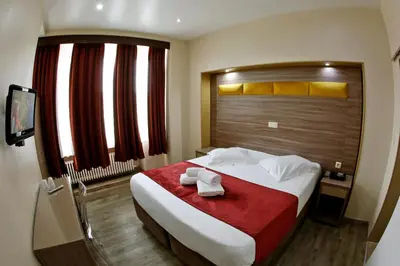 a hotel room with a bed with towels on it at Hotel de France in Brussels