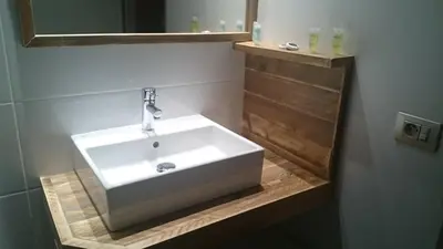 a bathroom with a white sink and a mirror at Hotel Panorama in Overijse
