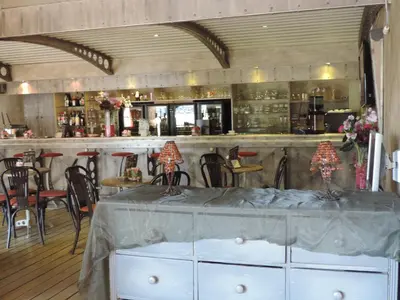 a bar with a table and chairs in a room at Hotel Panorama in Overijse