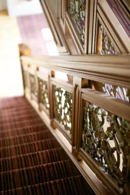 a row of stairs with stained glass at Hotel Villa Monte in Heist-op-den-Berg