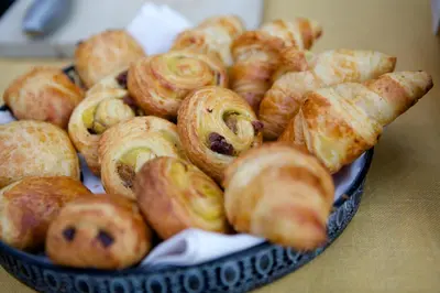 a bunch of pastries in a bowl on a table at Hotel Villa Monte in Heist-op-den-Berg