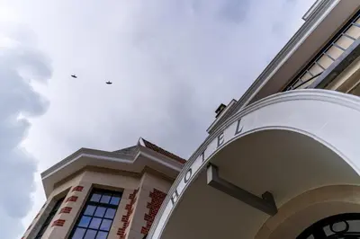 a building with a stairway on the side of it at Hotel Villa Monte in Heist-op-den-Berg
