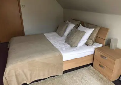 a bedroom with a bed with white sheets and pillows at Apartments Business Flats Brussels Airport in Zaventem