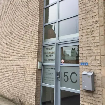 a sign in the door of a building at Apartments Business Flats Brussels Airport in Zaventem
