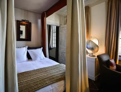 a hotel room with a bed and a window at B&B The Verhaegen in Ghent
