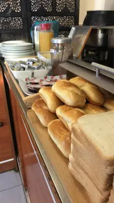 a bunch of bread on a counter in a kitchen at Royal Hotel in Brussels