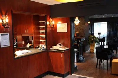 a salon with a phone in a room at Hotel Royal Zelzate in Zelzate