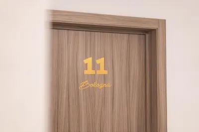 a wooden door with the number on it at Hotel Italia in Zelzate