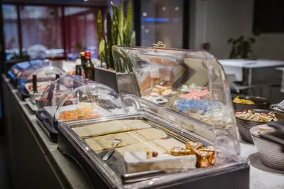 a buffet line with many different types of food at Corbie Mol in Mol
