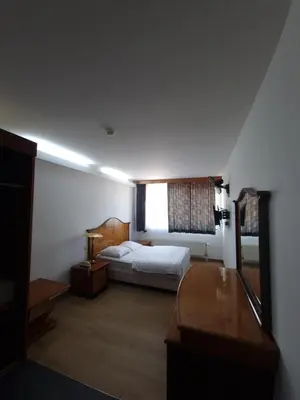 a hotel room with a bed and a window at SKY APART HOTEL - Hotel EUROCAP in Brussels