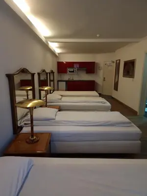 a room with four beds in a room at SKY APART HOTEL - Hotel EUROCAP in Brussels