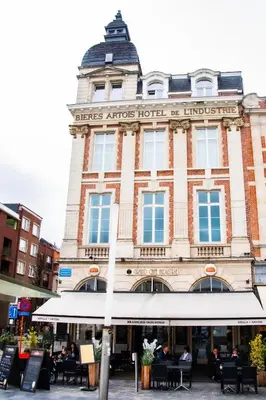 a building with a sign on the front of it at Hotel Industrie in Leuven
