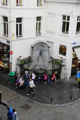 a group of people standing in front of a building at Hotel La Vieille Lanterne in Brussels