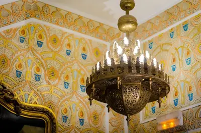 a chandelier hanging from a wall in a room at Hotel Mozart in Brussels