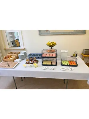 a table with several different types of food on it at Institute Of Cultural Affairs in Brussels