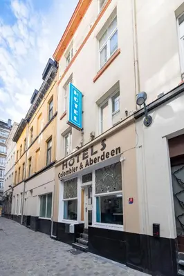 a building with a sign on the side of it at Hotel Abberdeen in Brussels