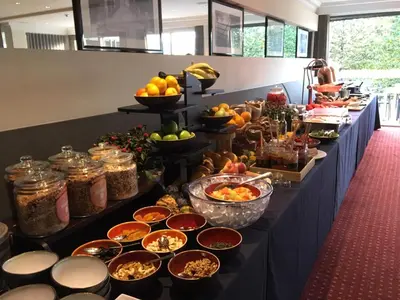a buffet line with many different types of food at Gosset Hotel in Groot-Bijgaarden
