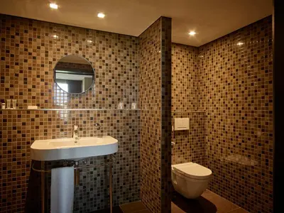 a bathroom with a sink and a toilet at Serwir Hotel in Sint-Niklaas