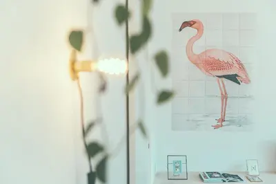 a picture of a pink flamingo on a wall at AP8 city & park apartement in Aalst