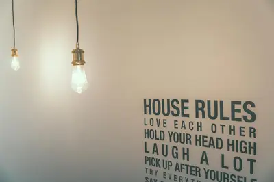 a wall with two lights and a sign on it at AP8 city & park apartement in Aalst