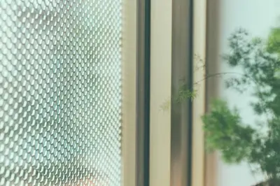 a close up of a window with a white pattern at AP8 city & park apartement in Aalst