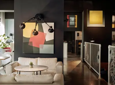 a living room with a white couch and a table at BANKS Antwerp in Antwerp