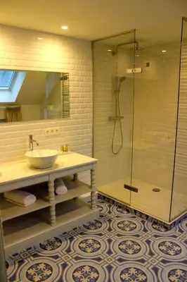 a bathroom with a sink and a shower at The Hamptons Boutique Hotel in Ghent
