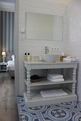 a white bathroom with a sink and a mirror at The Hamptons Boutique Hotel in Ghent
