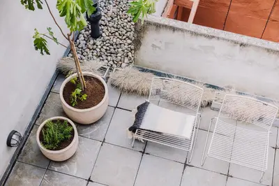 an aerial view of a patio with chairs and plants at Burgstraat 8 in Ghent