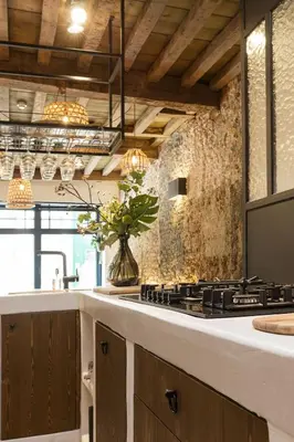 a kitchen with a counter with a stove top at Boutique Holiday Home Zalig In Antwerpen in Antwerp