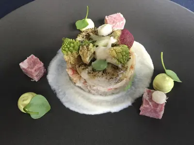 a plate of food with broccoli and other foods at B&B VIENNA in Lokeren