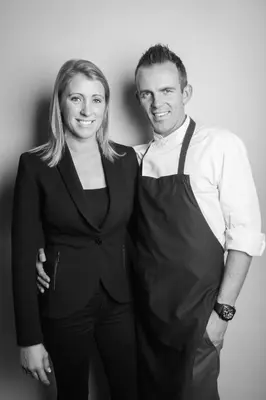 a man and a woman posing for a picture at B&B VIENNA in Lokeren