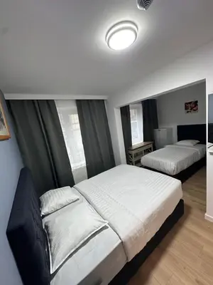 a bedroom with two beds in a room at Hotel Albert in Brussels