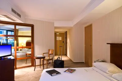 a hotel room with a bed and a television at B-aparthotel Ambiorix in Brussels