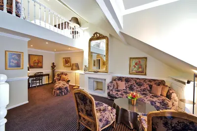 a living room with a couch and a table at Hotel Manos Premier in Brussels