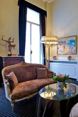 a living room with a couch and a table at Hotel Manos Premier in Brussels